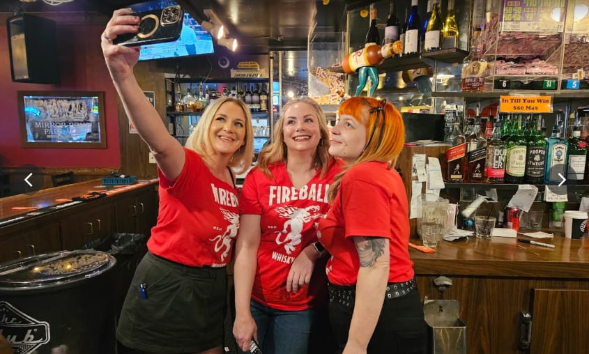 Bartenders behind the bar at Dax's