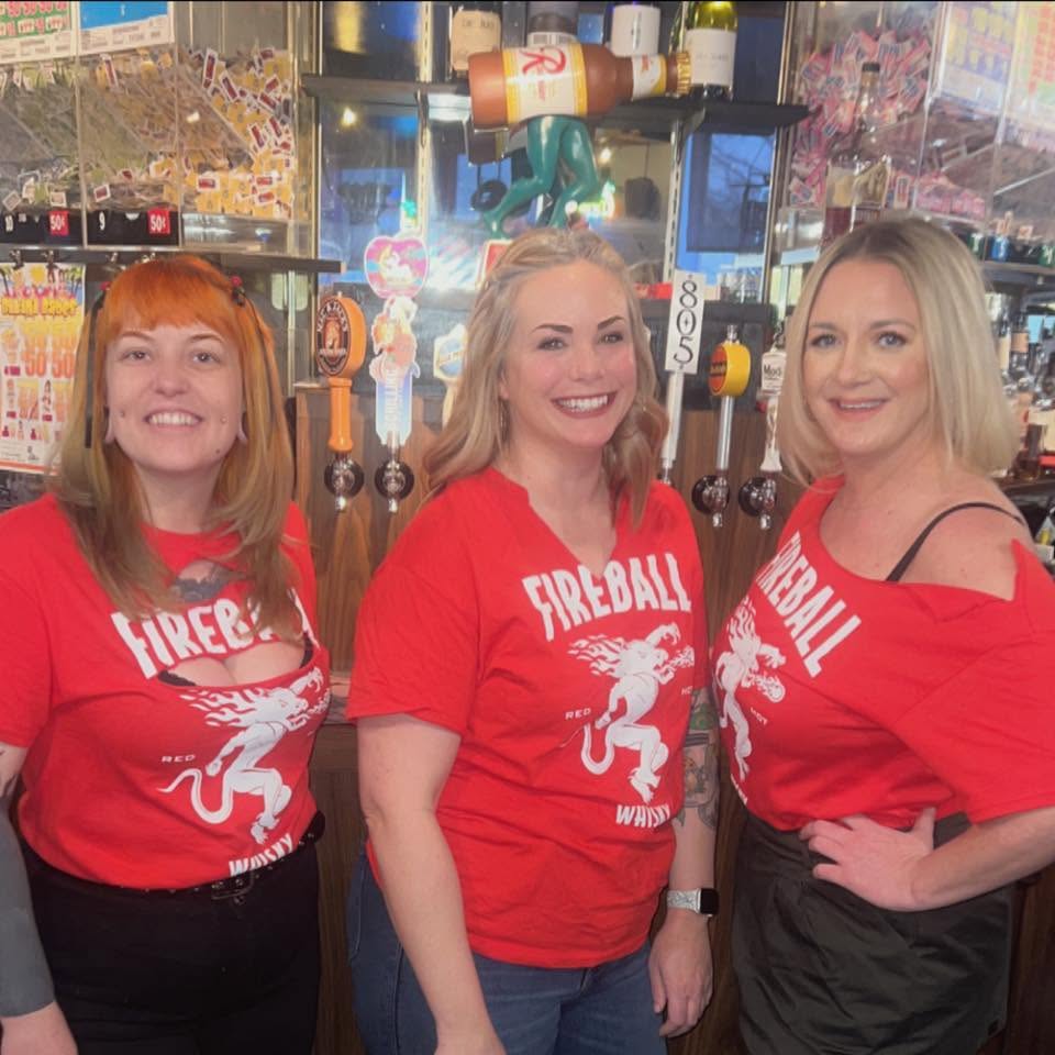 The bartenders at Dax's behind the taps